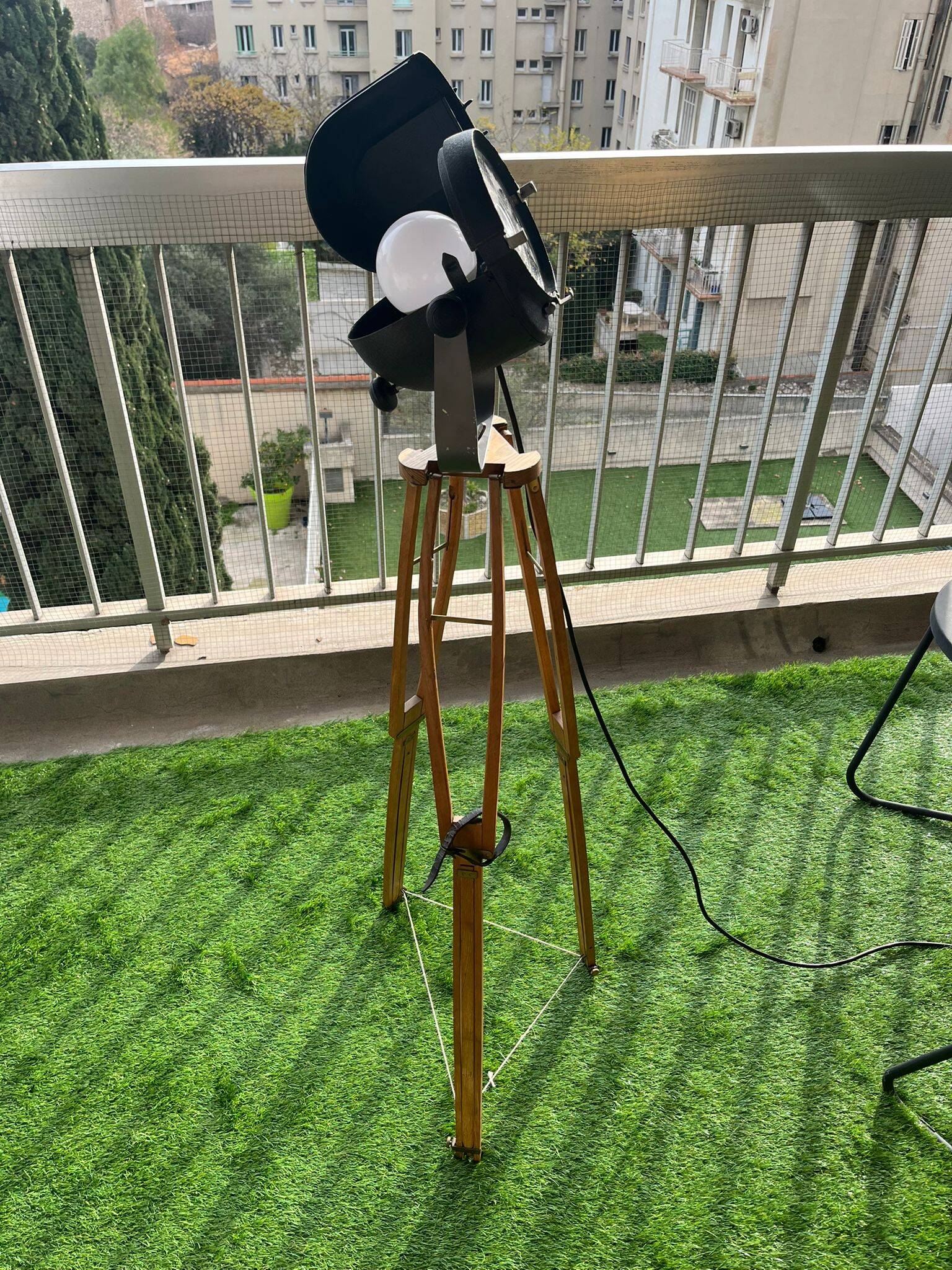 Floor lamp in the style of a cinema projector.