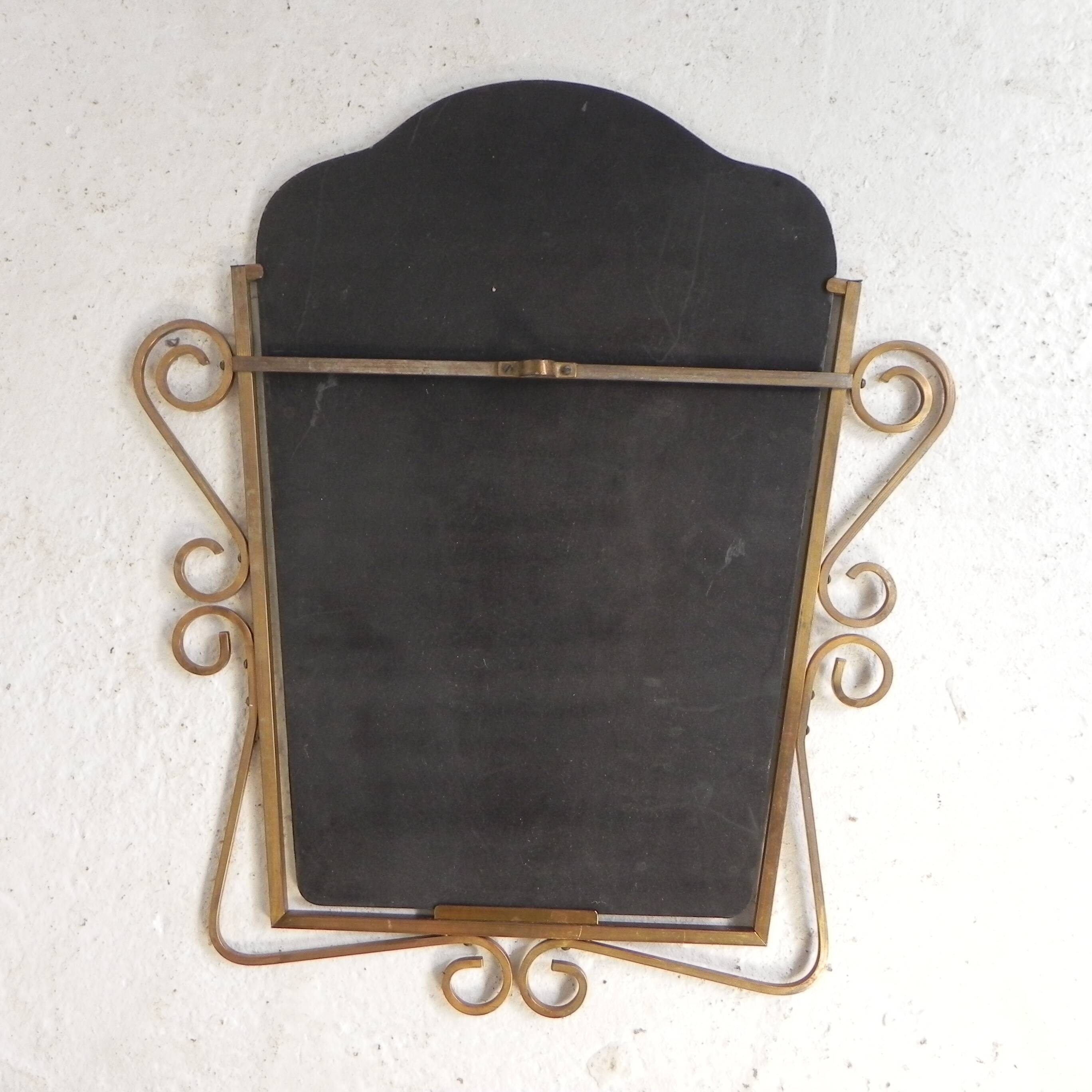 Vintage faceted mirror in a brass frame, 1950s.