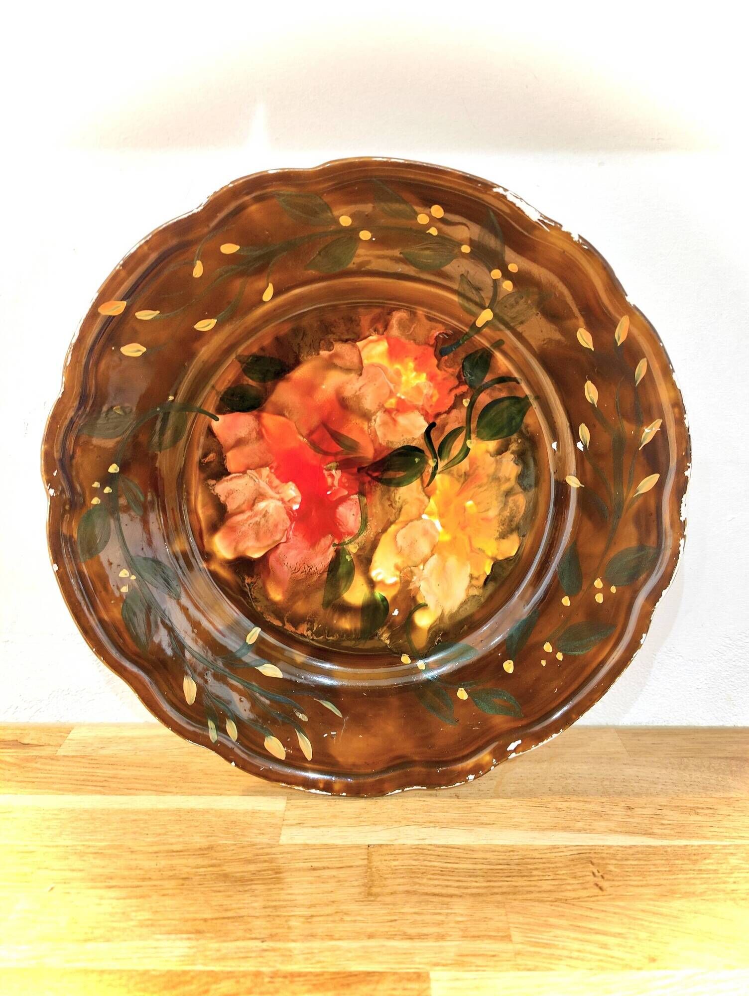 Decorative plate in brown faience