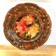 Decorative plate in brown faience