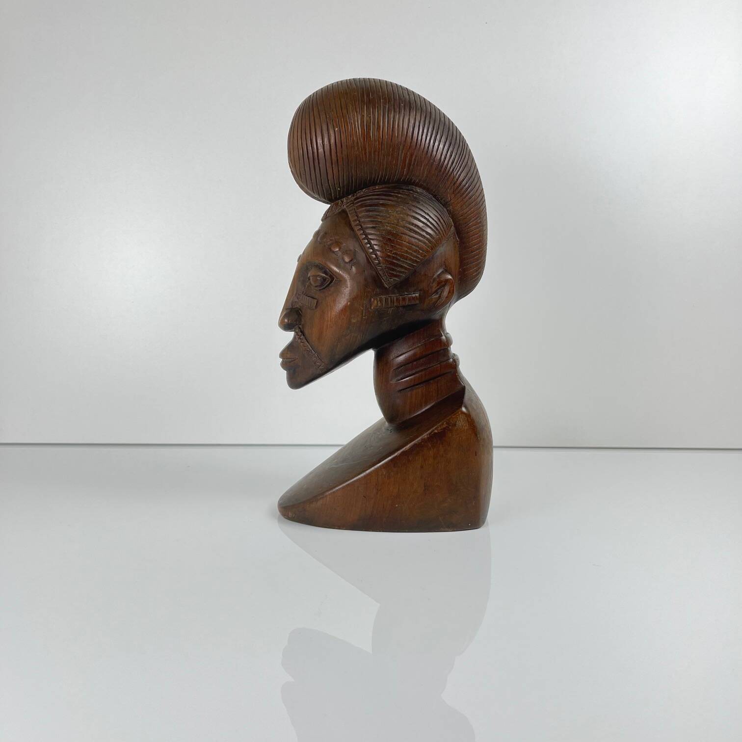 Hand-carved female bust in black wood, Baoulé style, 1960/90