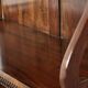 Elegant wooden  bookcase with a classic English look from the 20th century