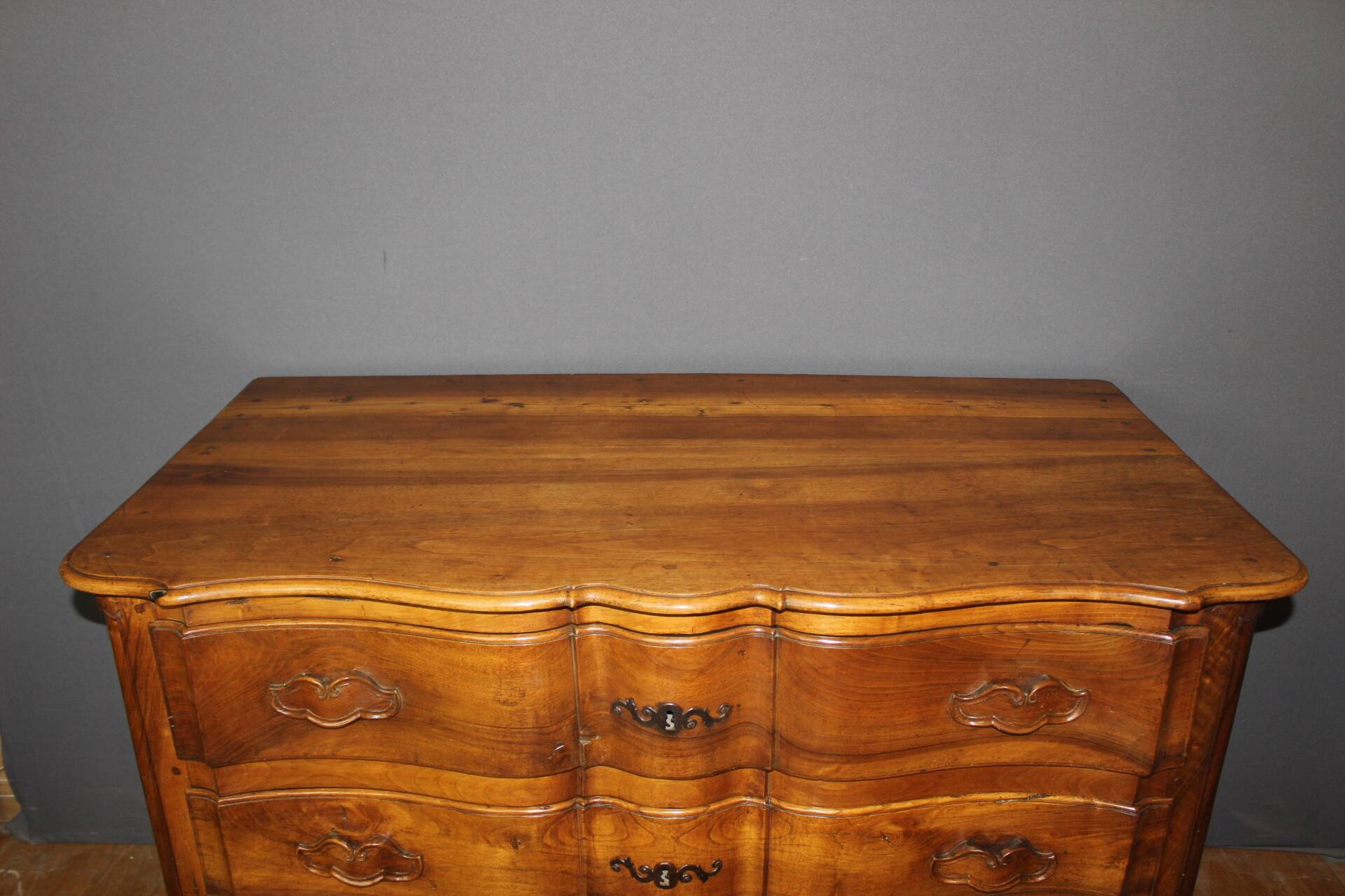 Eighteenth-century walnut crossbow commode.