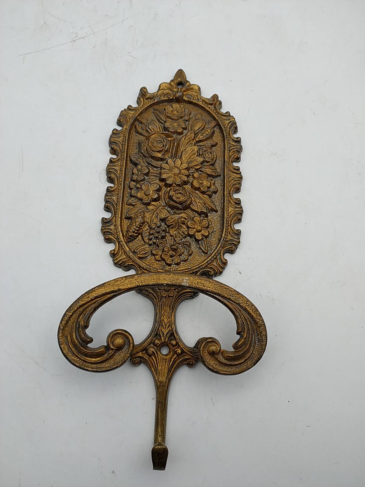 Brass coat rack with floral decoration