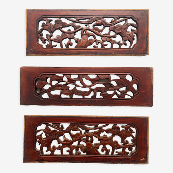 Set of three carved Asian panels