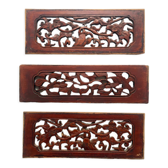 Set of three carved Asian panels