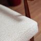 Vintage salon chair in white boucle with a 1950s design.