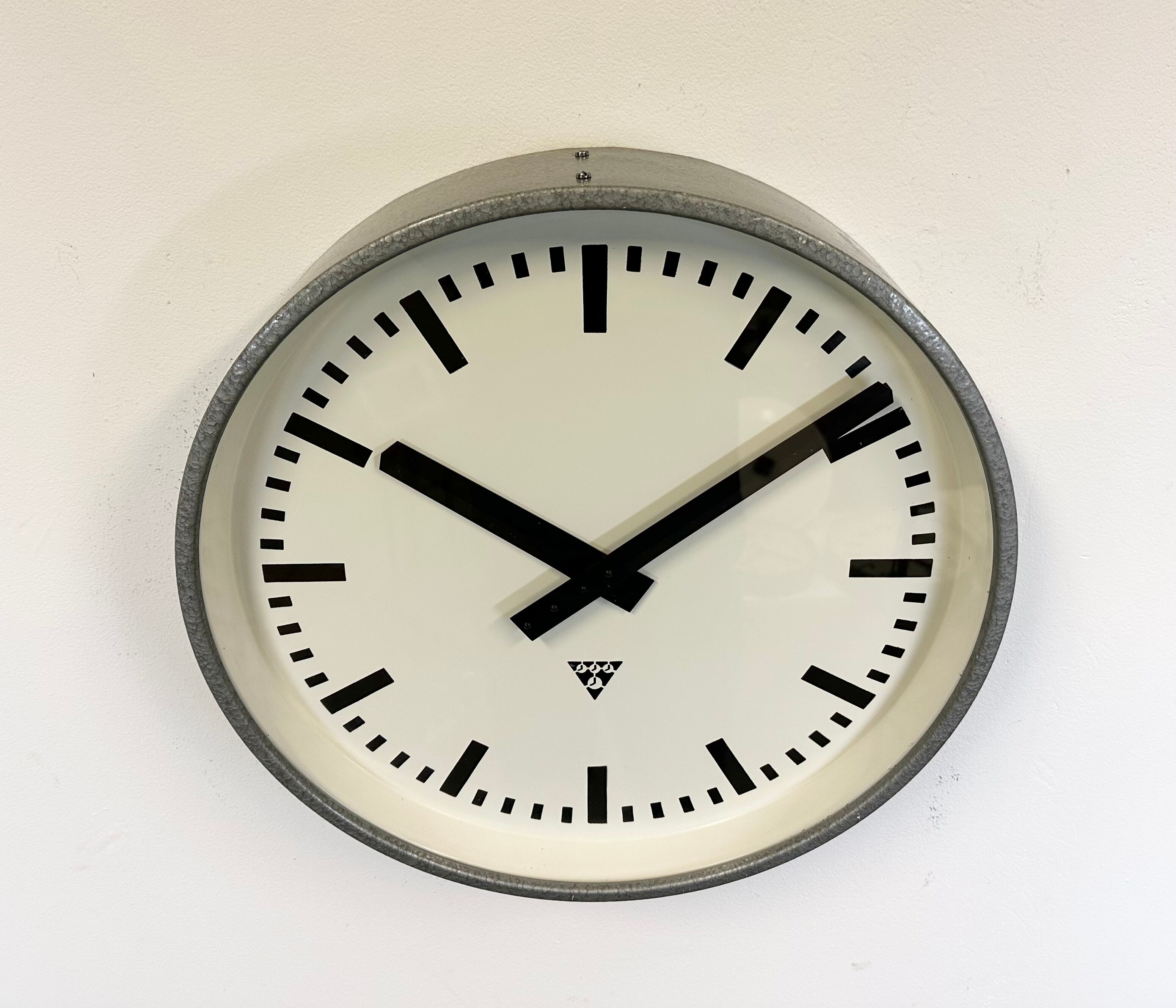 Grey industrial factory wall clock from pragotron, 1960s