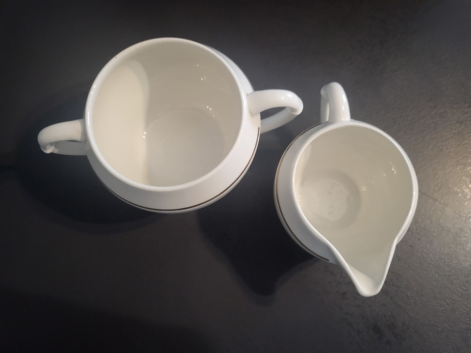 1 milk jug and 1 sugar jar