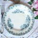 Mismatched antique flat plates made of ironstone accompanied by