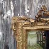 Wooden fireplace mirror and Gilded Louis XVI-style plaster with leaf