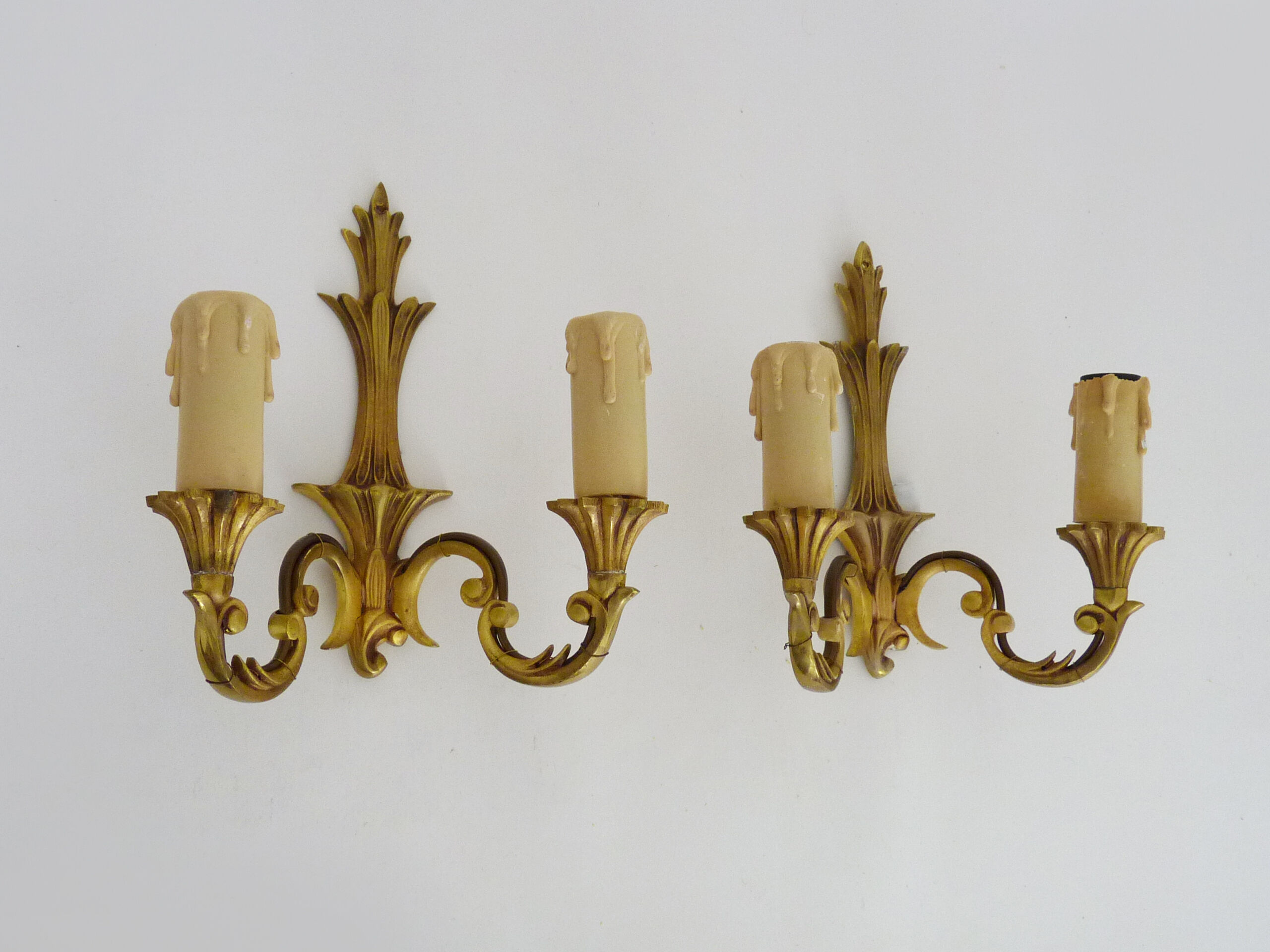 Old pair of wall sconces with double fires in bronze, seventies
