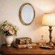 Small vintage oval mirror in gilded resin – 1960s
