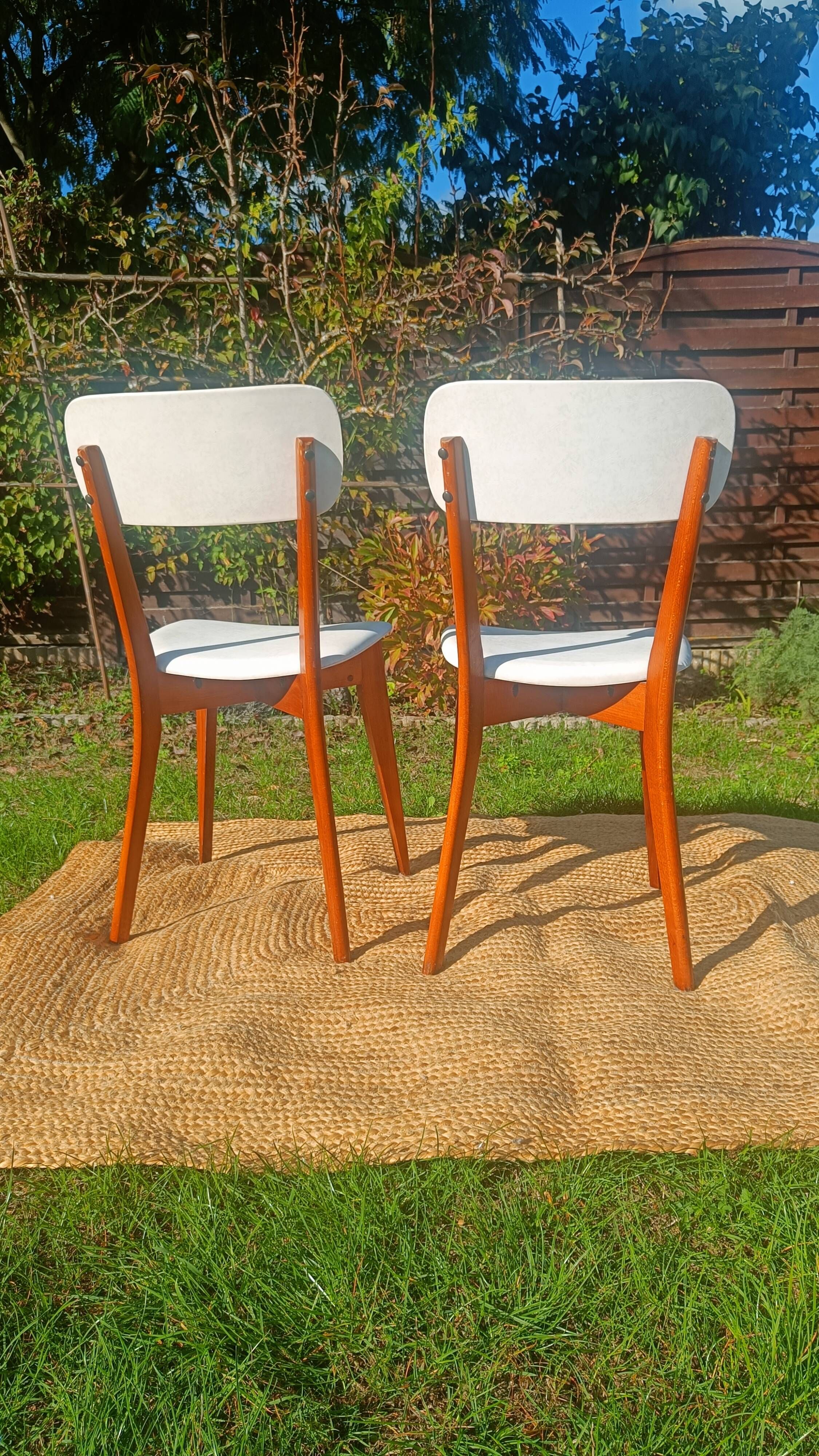 vintage wooden chairs with white faux leather