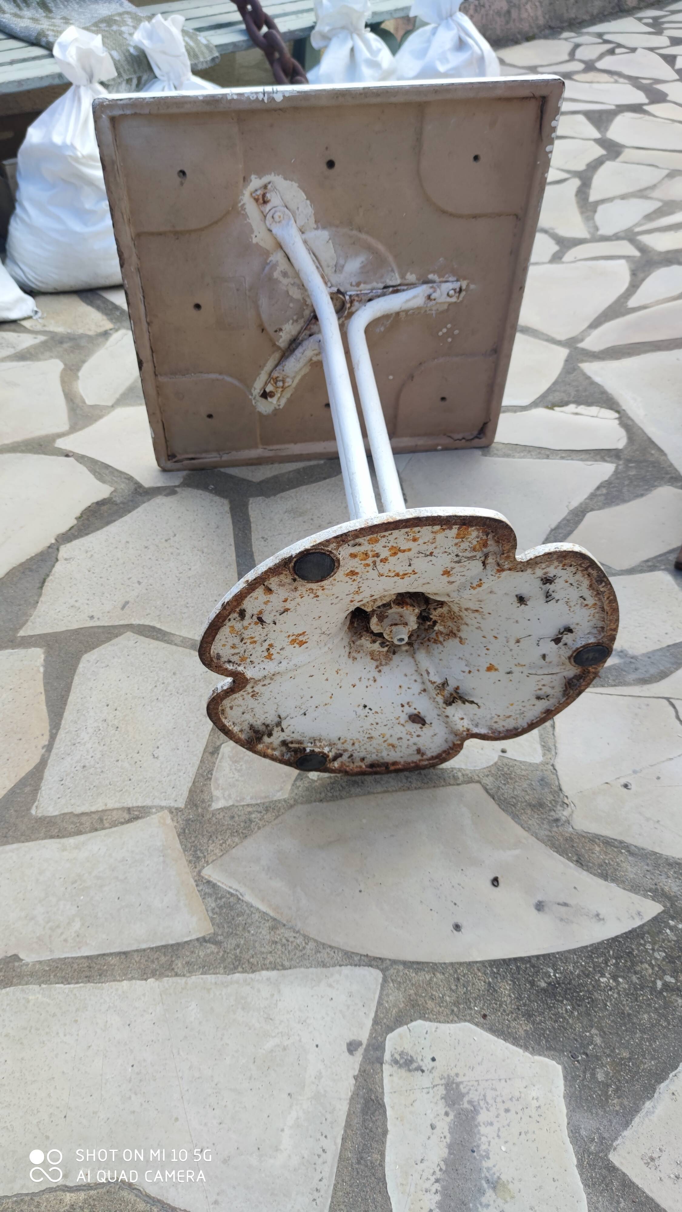 Garden or bistro table with steel and fiberglass base and top, circa 1970