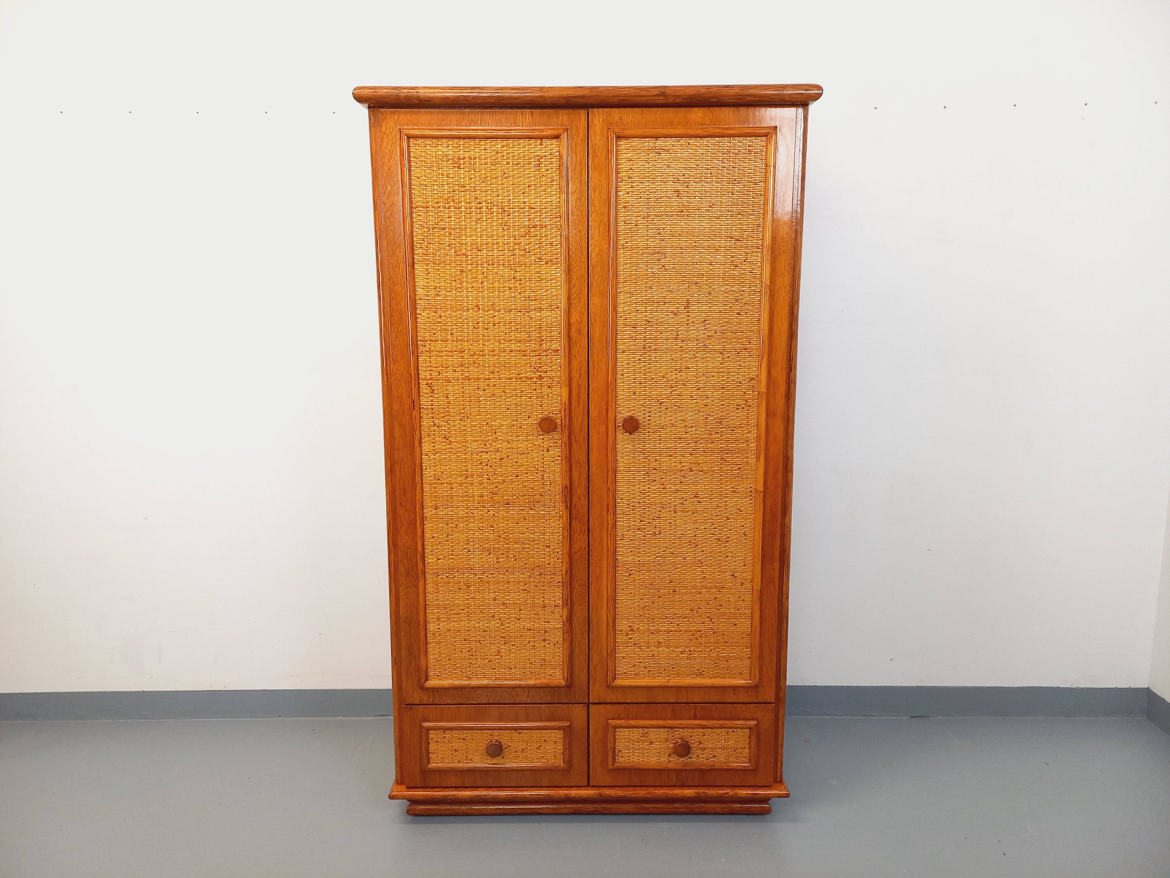 Vintage woven rattan and wood armoire by Maugrion for Roche-Bobois.