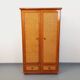 Vintage woven rattan and wood armoire by Maugrion for Roche-Bobois.