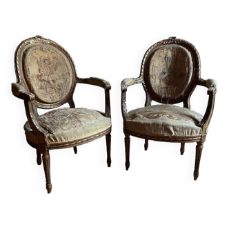 Pair of Louis XVI armchairs in gilded wood