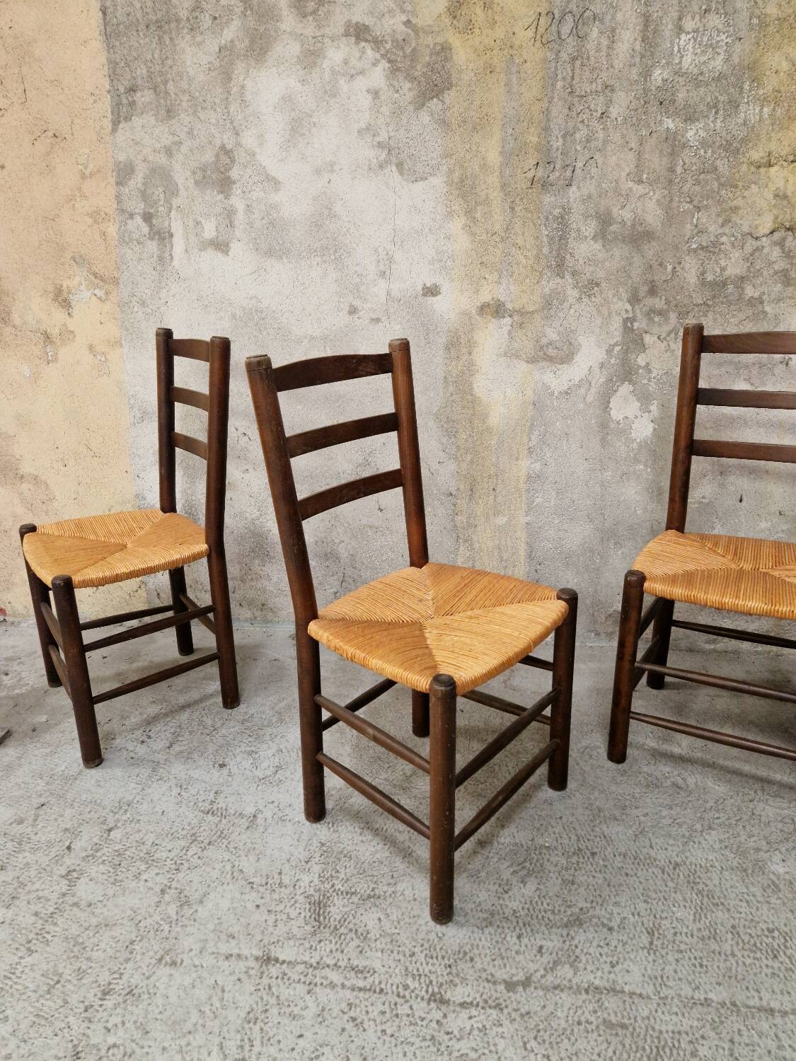 4 wooden and straw chairs