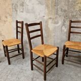 4 wooden and straw chairs