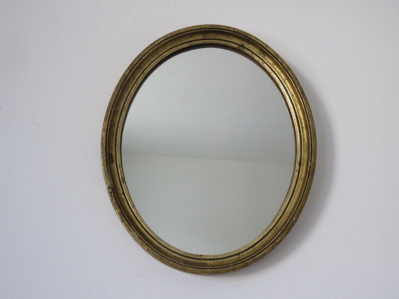 Old oval mirror in gilded wood 50s 60s