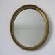 Old oval mirror in gilded wood 50s 60s