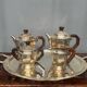 Art Deco tea and coffee service. Silver-plated metal and mahogany.