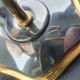 Pair of antique gold-plated brass and smoked glass wall lights.