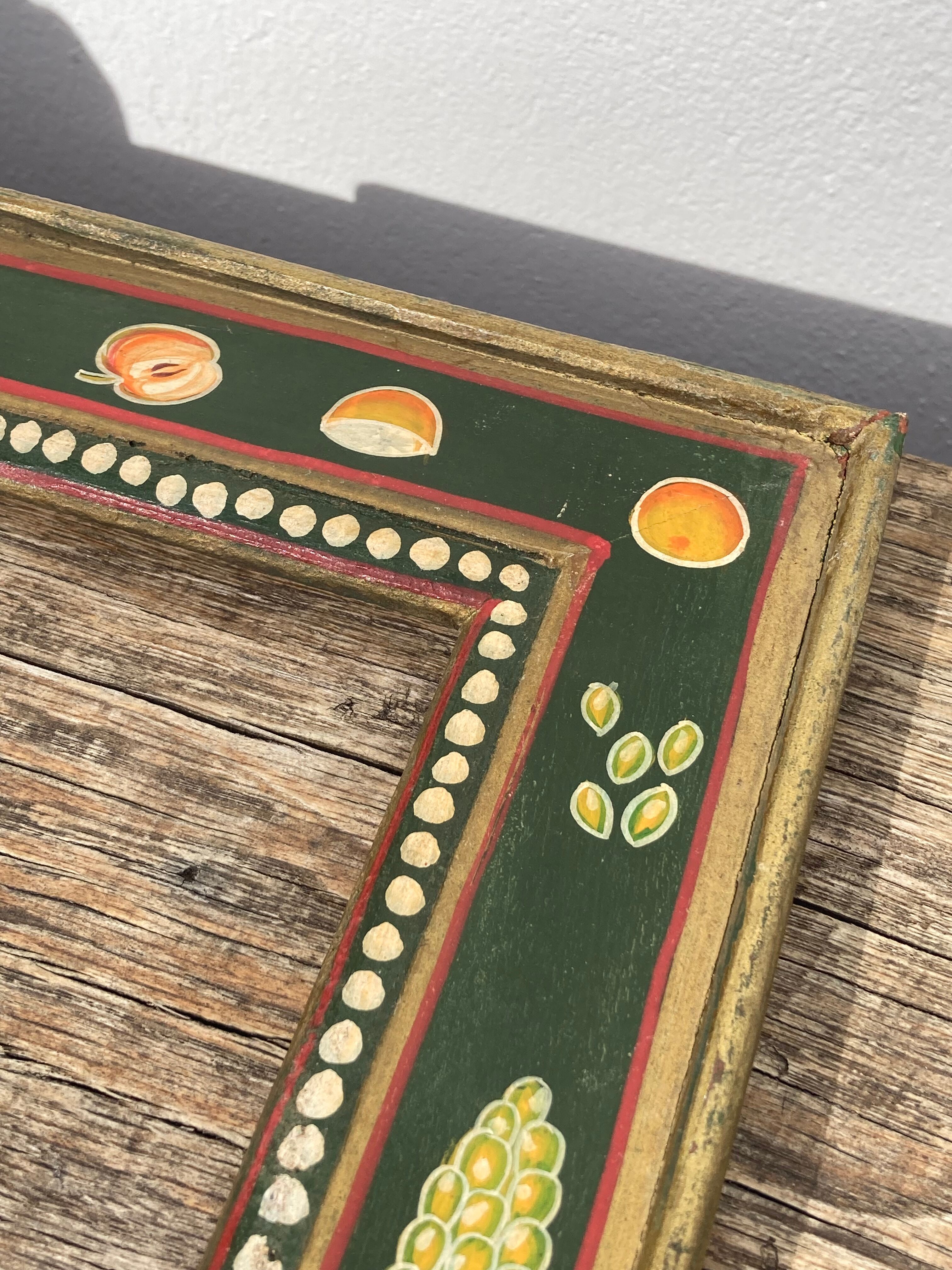 Hand-painted wooden frame with fruit decoration