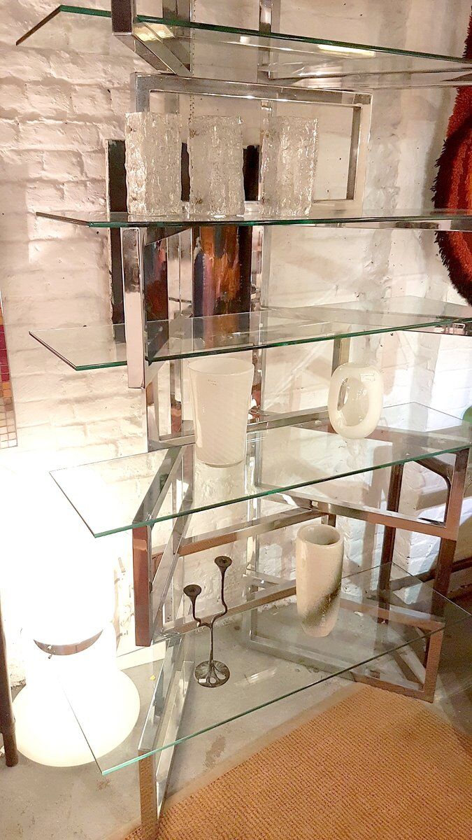 Articulated presentation shelf in chrome and glass. Italy 1970s