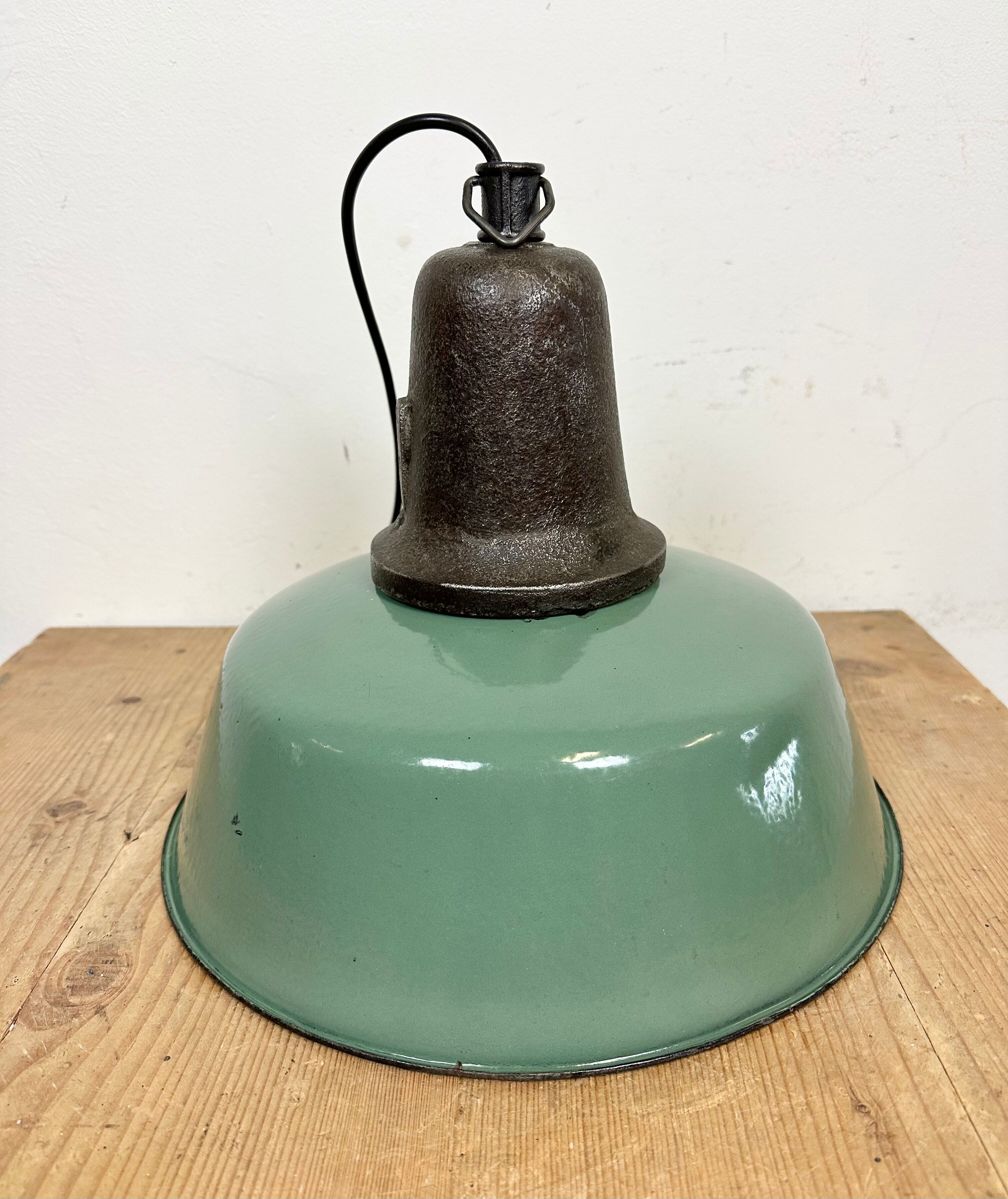 Industrial green enamel factory lamp with cast iron top, 1960s