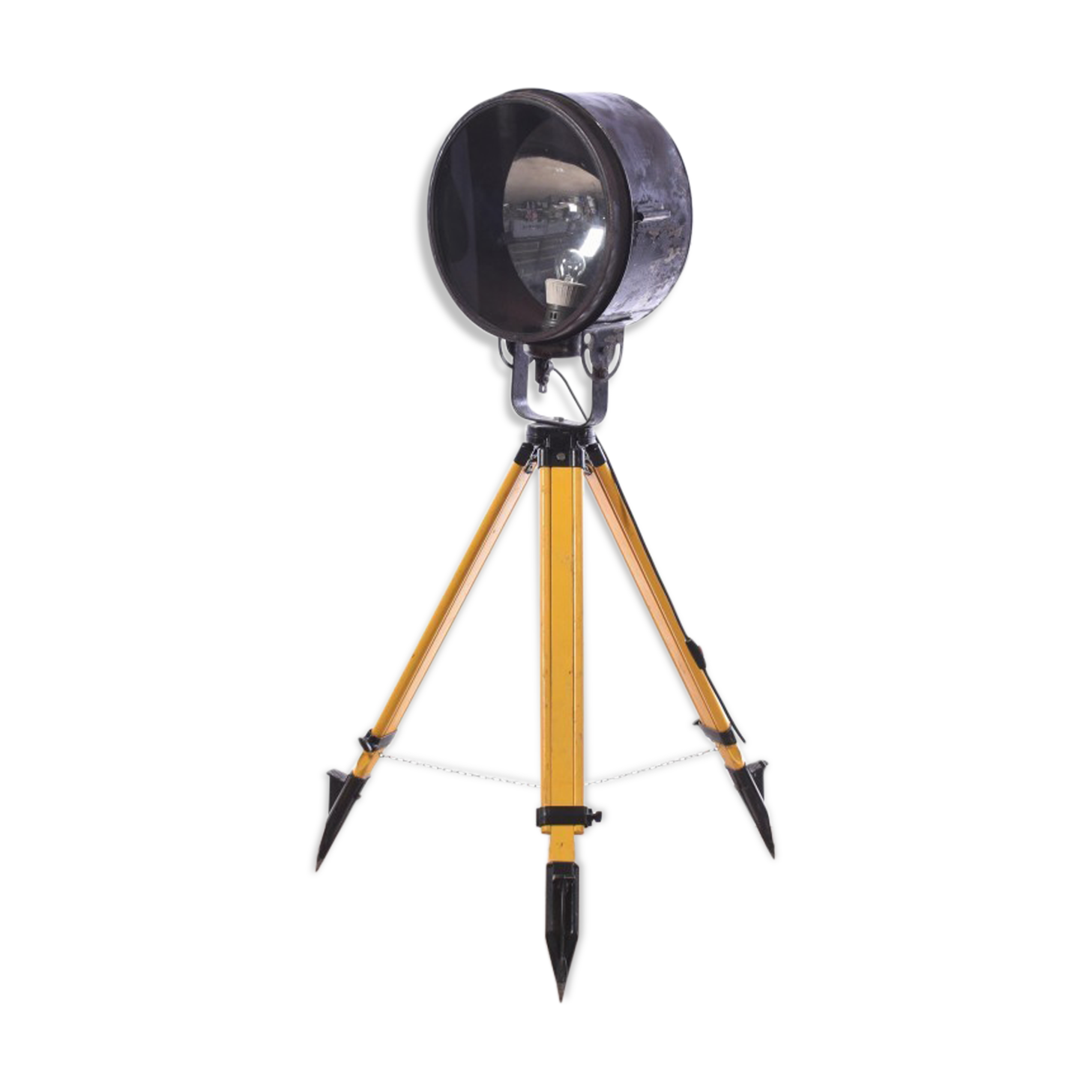 Old industrial spot on wooden tripod