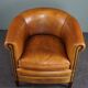 Club armchair in cognac-colored sheepskin