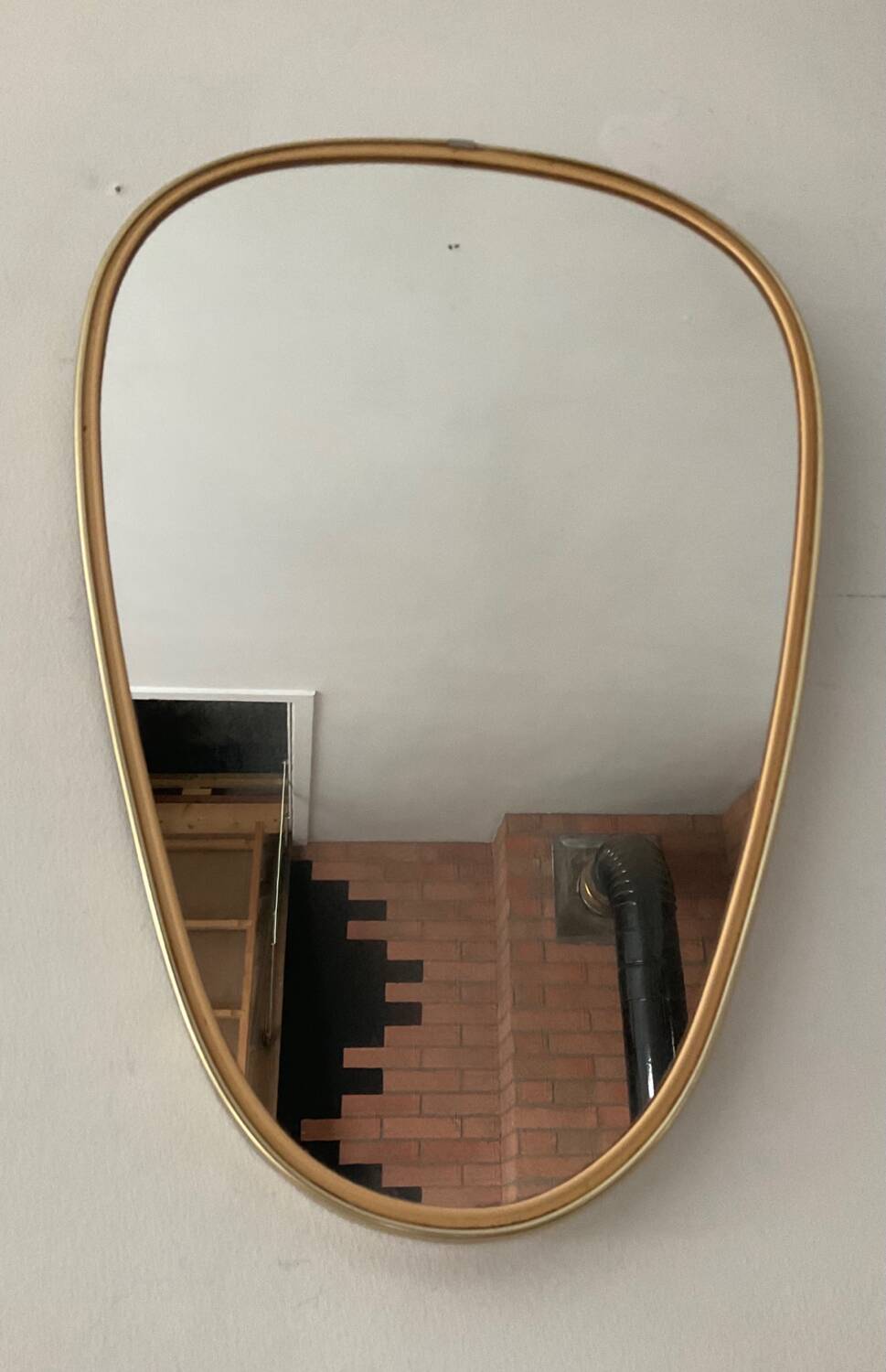 Asymmetrical free-form mirror from the 60s and 70s