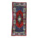 Vintage hand-knotted wool rug with polychrome decoration on a red, blue, green background 150 x 63 cm