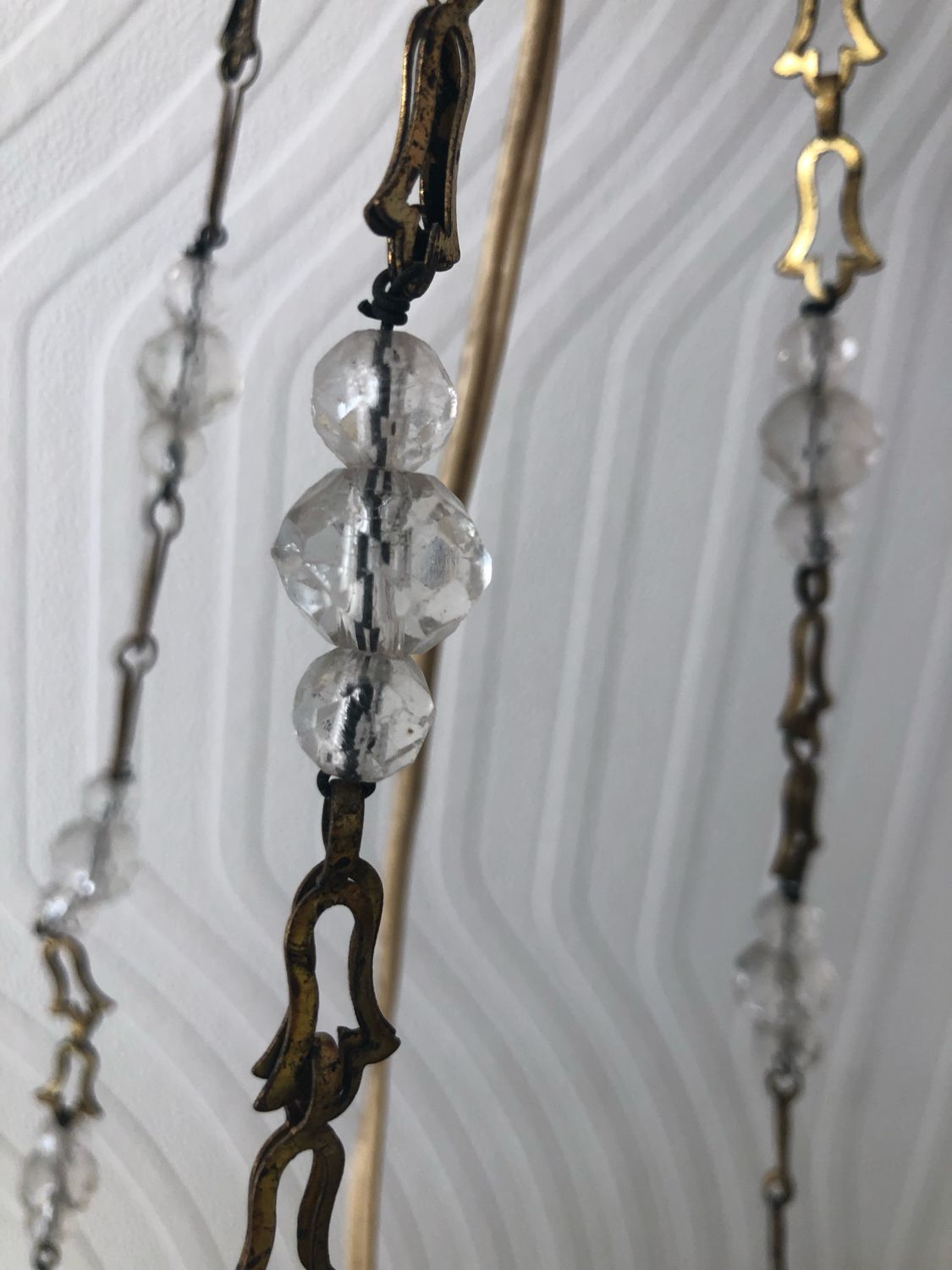 Vintage tassel chandelier has 2 glass and brass crowns