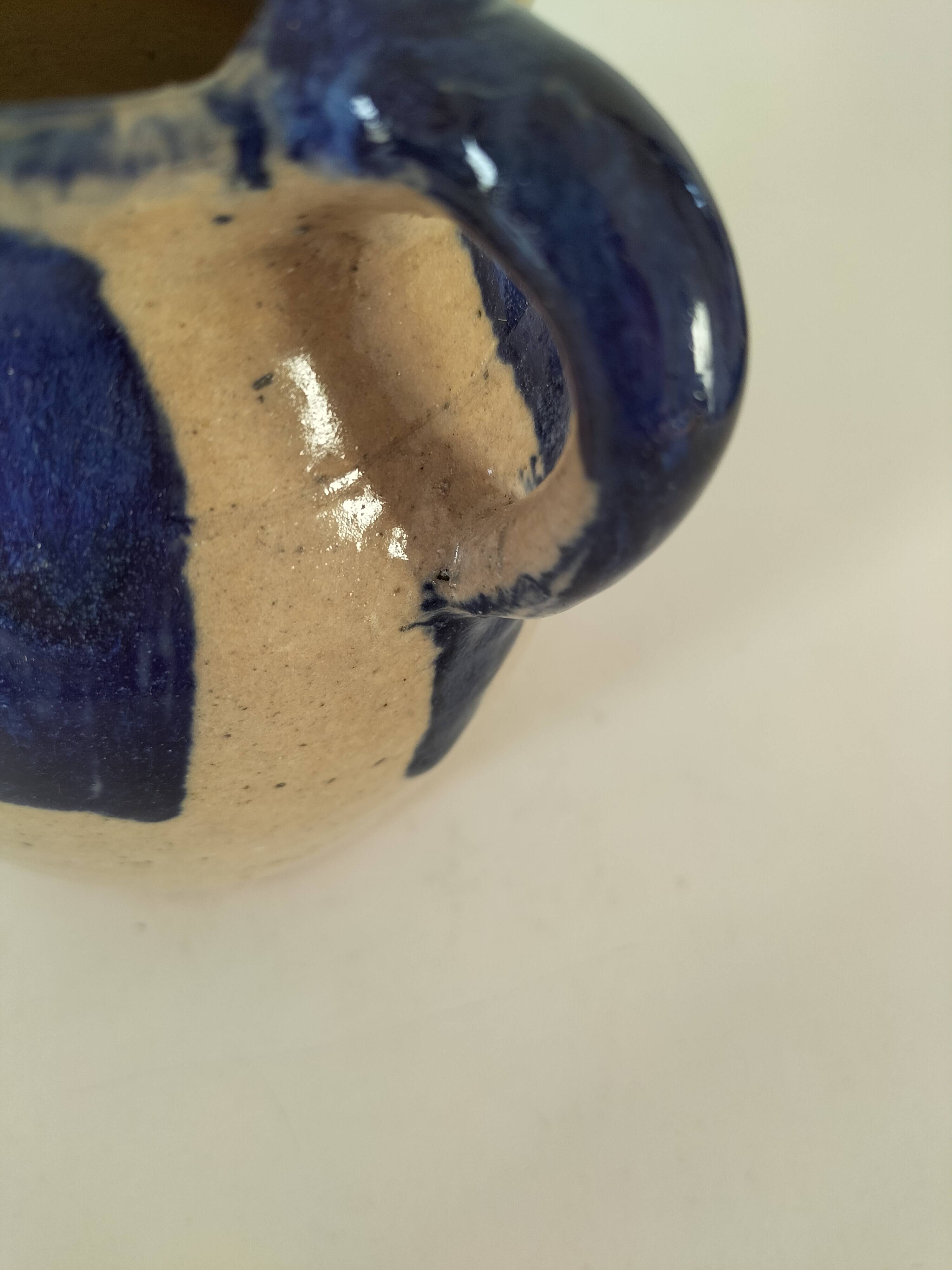 Old pitcher (goat) in cobalt glazed earthenware