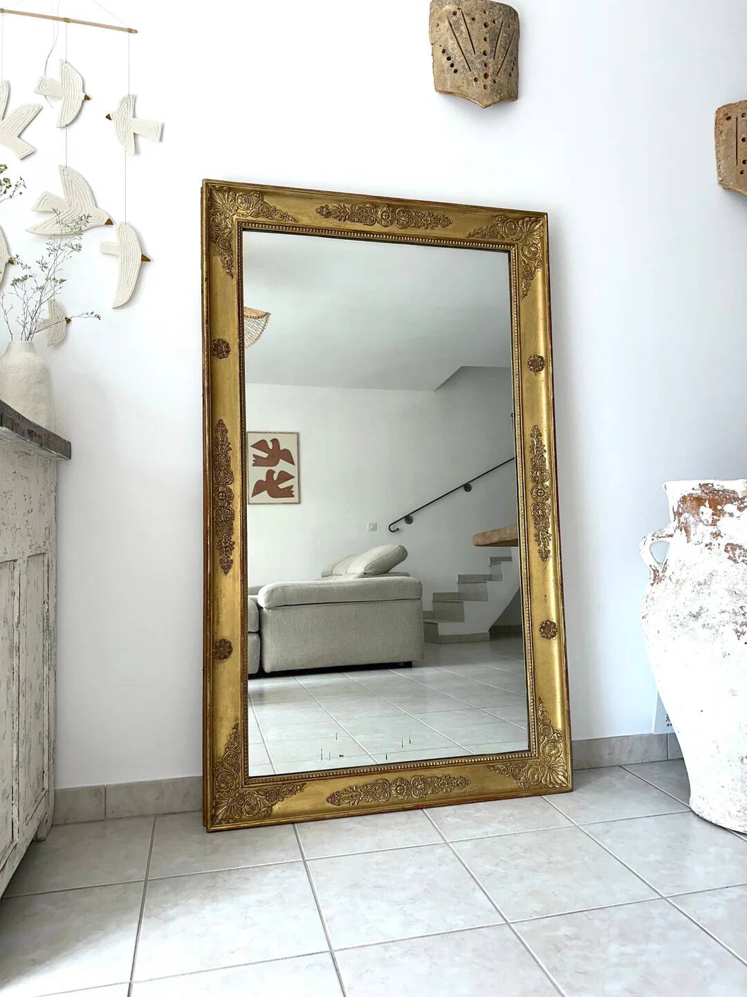 Antique gilded mirror from the Restoration period, 19th century.