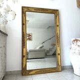 Antique gilded mirror from the Restoration period, 19th century.