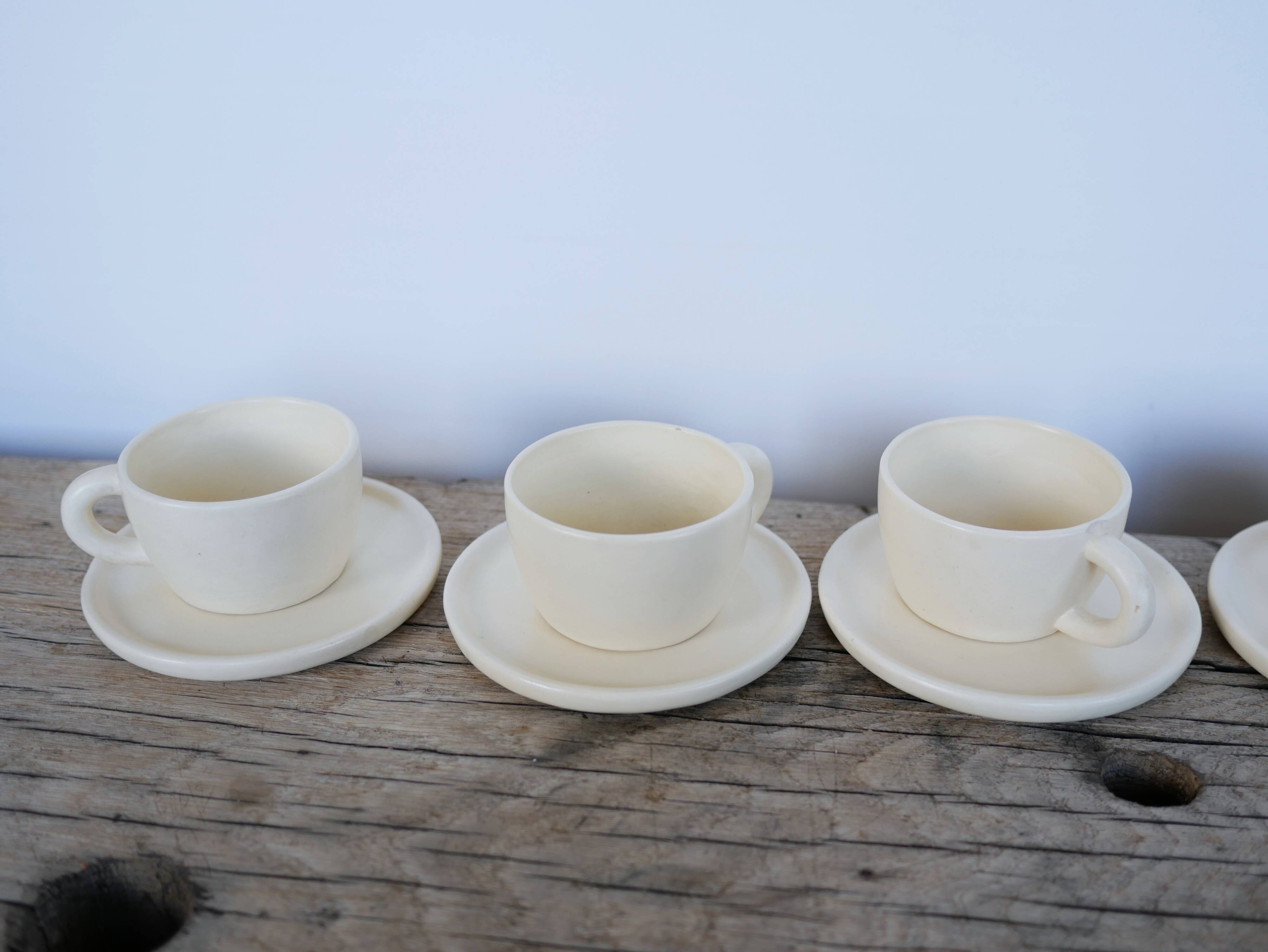 Series of 7 vintage ceramic cups and saucers by Le Pot de Terre