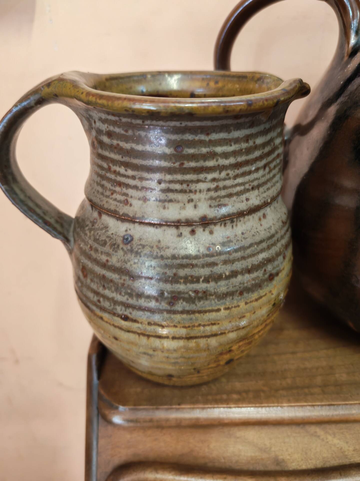 Set of three vintage ceramic jugs and a pitcher.