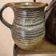Set of three vintage ceramic jugs and a pitcher.