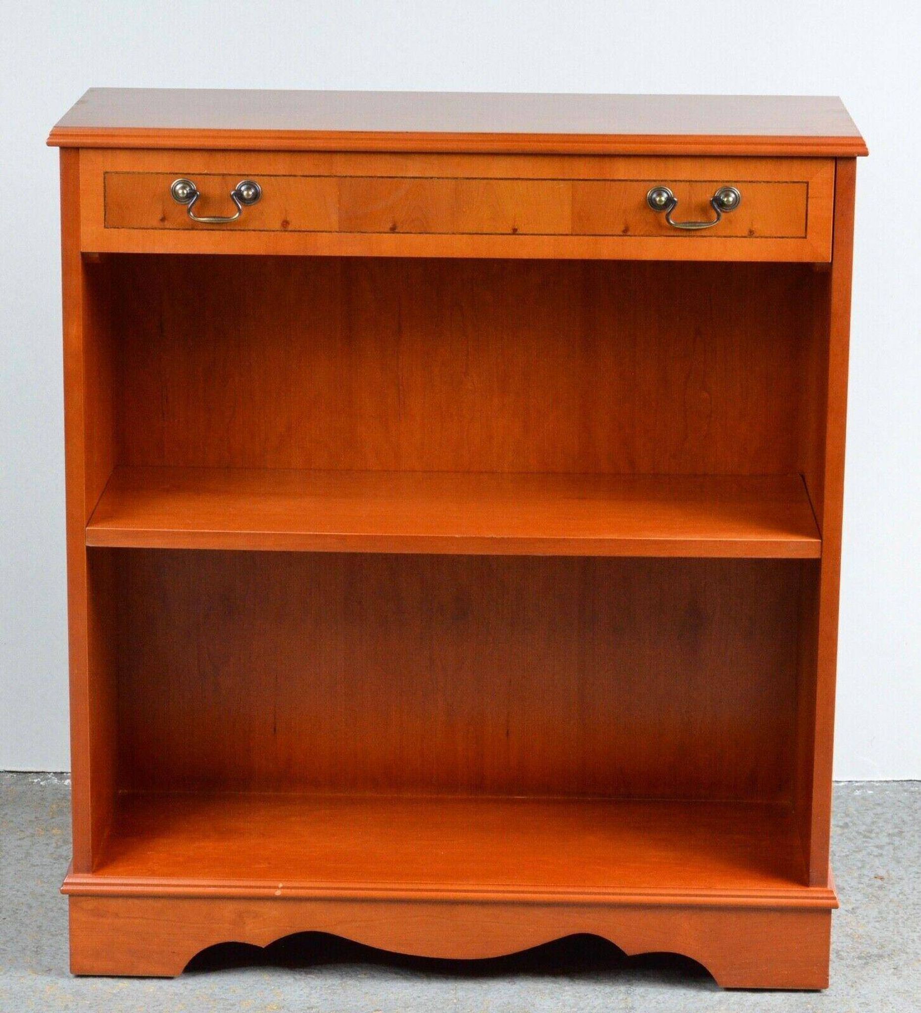 Pair of light walnut bookshelves with inlays and adjustable shelves.