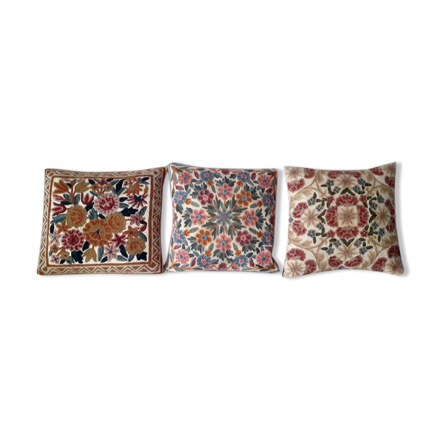 Set of three old hand-embroidered wool cushions