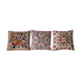 Set of three old hand-embroidered wool cushions
