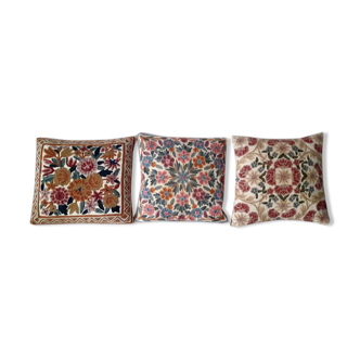 Set of three old hand-embroidered wool cushions