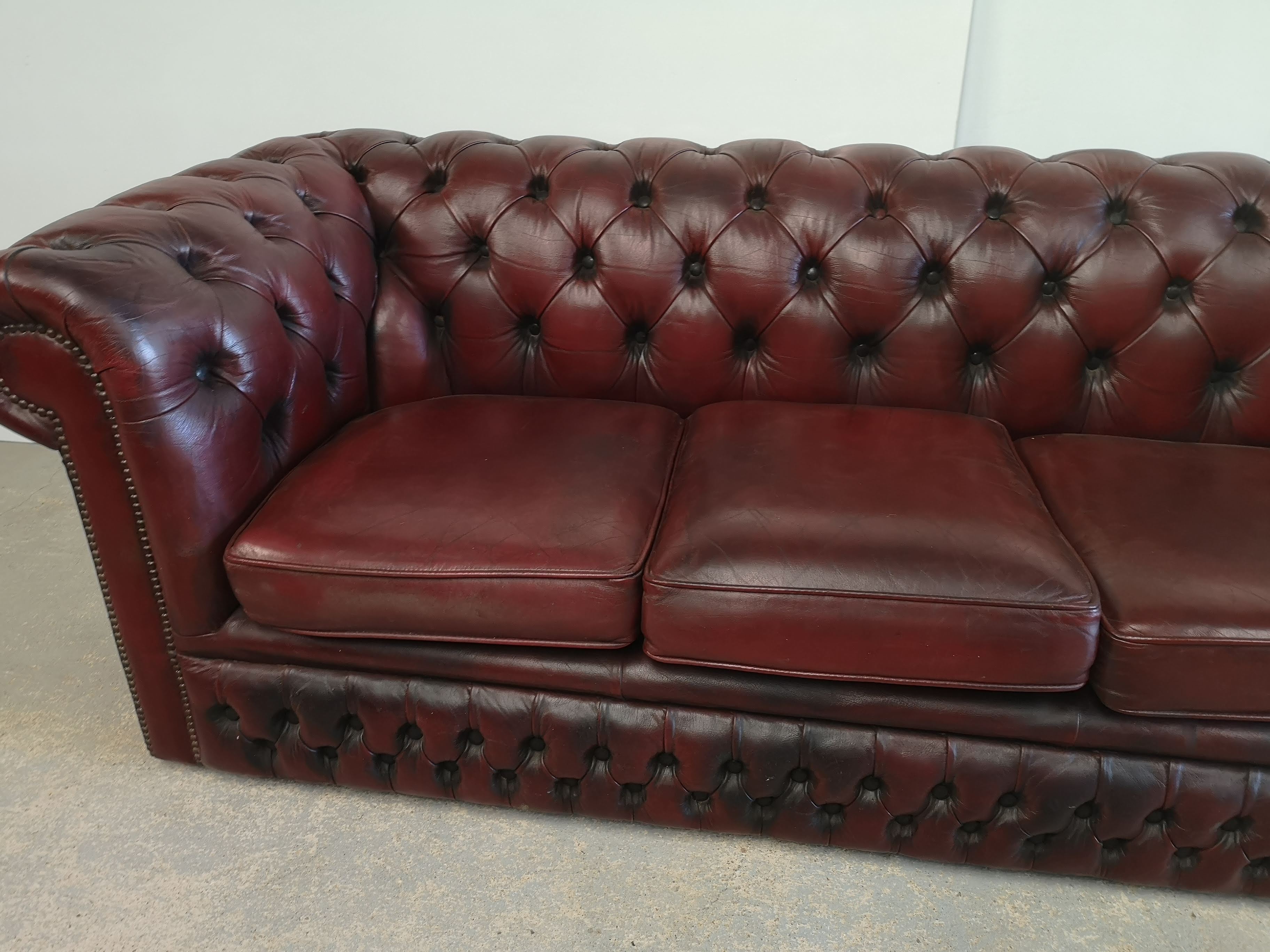 Burgundy leather chesterfield sofa