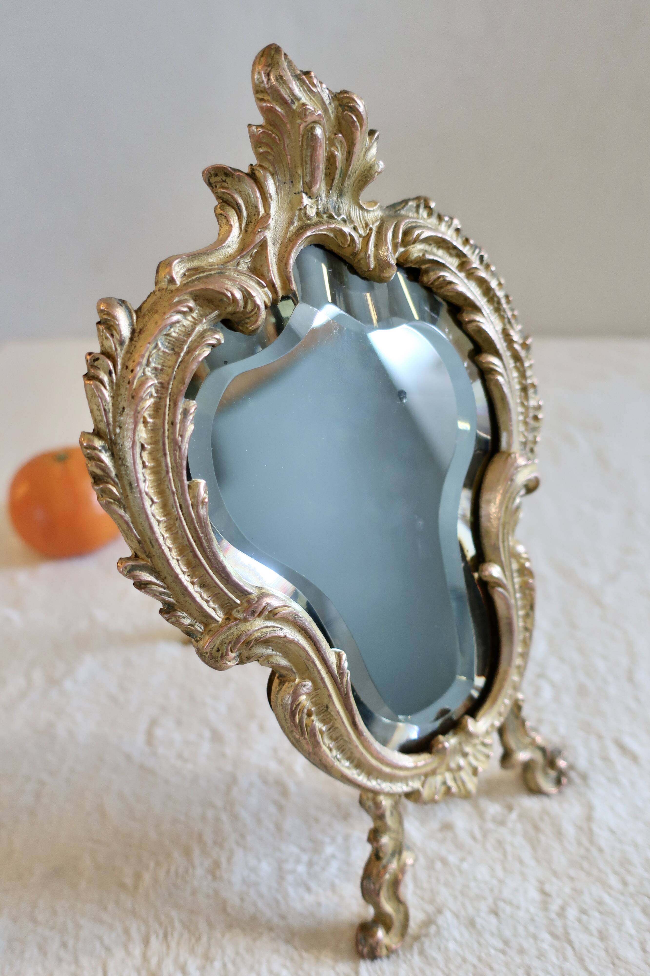 Small vintage 19th century mirror or hand mirror, bronze, beveled glass, baroque, rococo style.