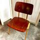 Chair in dark wood and ocher metal