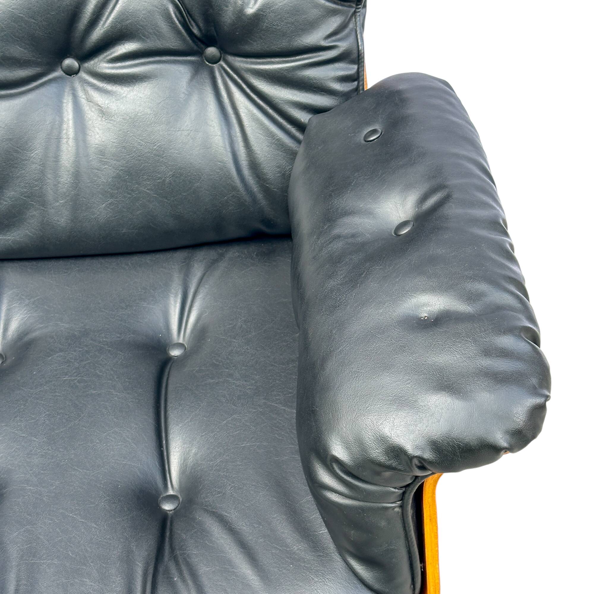 Vintage armchair in leather and rosewood inspired by Martin Stoll design 1970